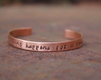 May include: Copper bracelet with the inscription "Everything happens for a reason".