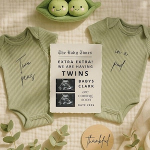 Puede incluir: Dos bodies de bebé verde salvia con las frases "Two peas" e "in a pod". Un anuncio estilo periódico dice "EXTRA EXTRA! WE ARE HAVING TWINS BABYS CLARK are coming soon DATE 202X". Un disco de madera dice "thankful".