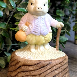 May include: A set of three ceramic mugs with a speckled, matte finish. The mugs are in shades of cream, light gray, and dark gray. Each mug has a simple, minimalist design, perfect for coffee or tea.