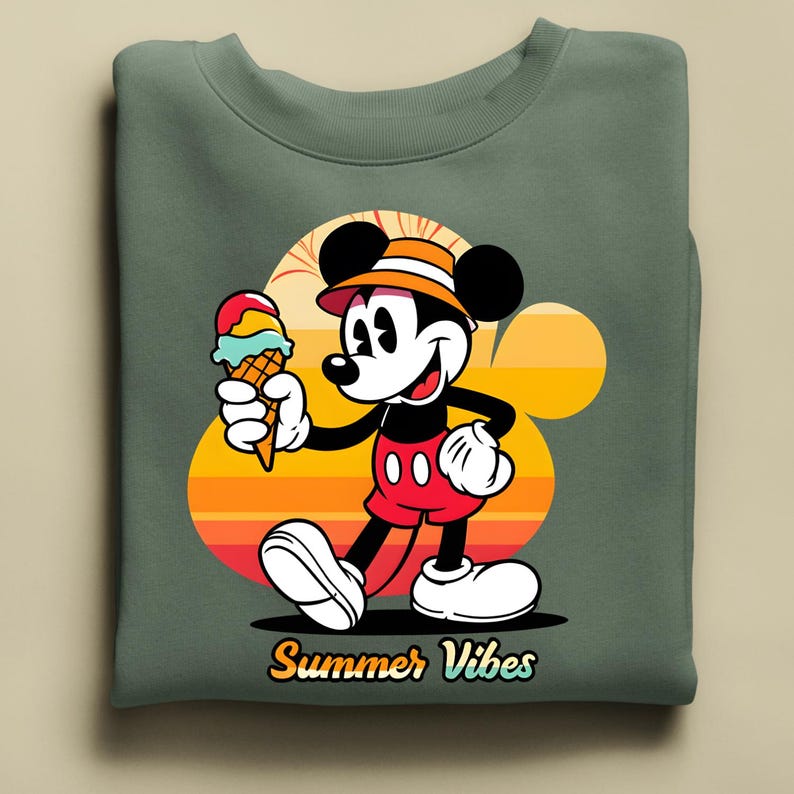 May include: Green sweatshirt featuring a cartoon Mickey Mouse holding an ice cream cone. Mickey is wearing a hat and red shorts. The background has a sunset design with the words "Summer Vibes" in a yellow font.