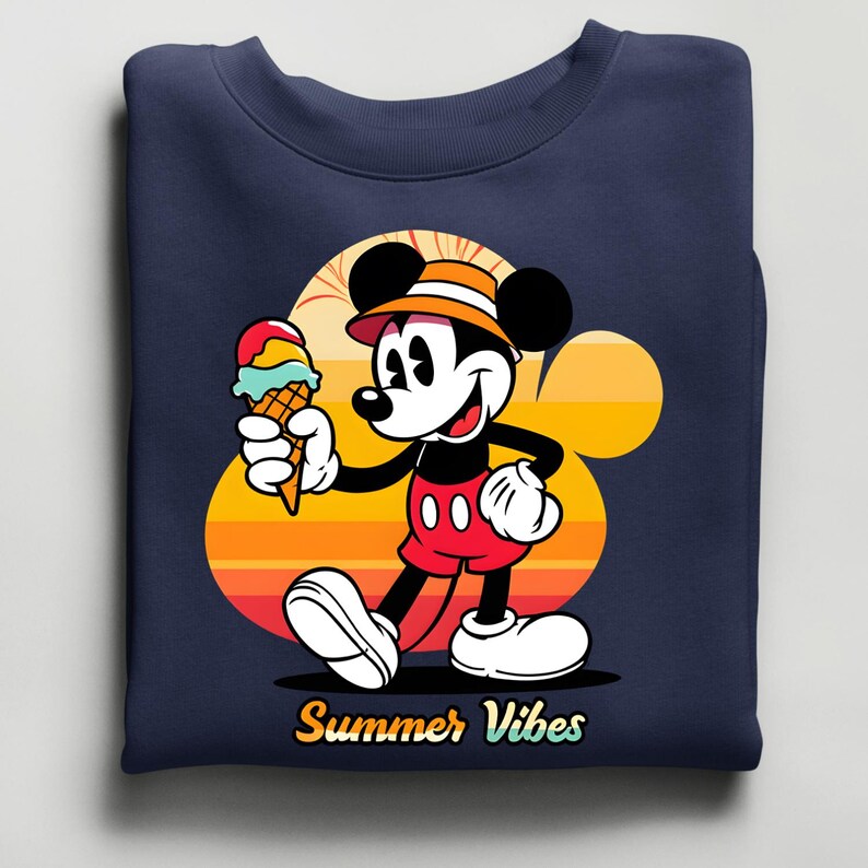 May include: Navy blue sweatshirt featuring a cartoon Mickey Mouse holding an ice cream cone. Mickey is wearing red shorts, white gloves, and a hat. The background has a sunset design with the words "Summer Vibes".