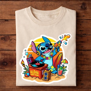 May include: Beige t-shirt featuring a colorful graphic of the character Stitch from Lilo & Stitch. Stitch is holding a water gun, wearing headphones and a lei, with the text "ALOHA PARTY MODE". The design includes a surfboard, cocktail, and a DJ setup.
