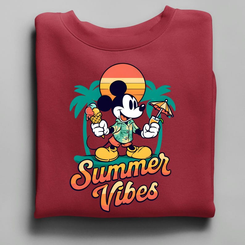 May include: Maroon sweatshirt featuring a cartoon Mickey Mouse design. Mickey is holding an ice cream cone and a tropical drink. The design includes a sunset, palm trees, and the words "Summer Vibes" in a retro font.