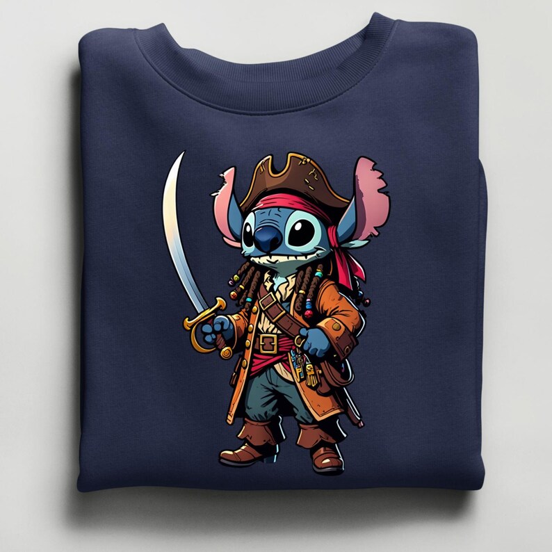 May include: Navy blue sweatshirt featuring a cartoon character dressed as a pirate. The character is blue with large eyes, wearing a brown pirate hat, coat, and boots, and holding a silver sword. The design is centered on the front of the sweatshirt.