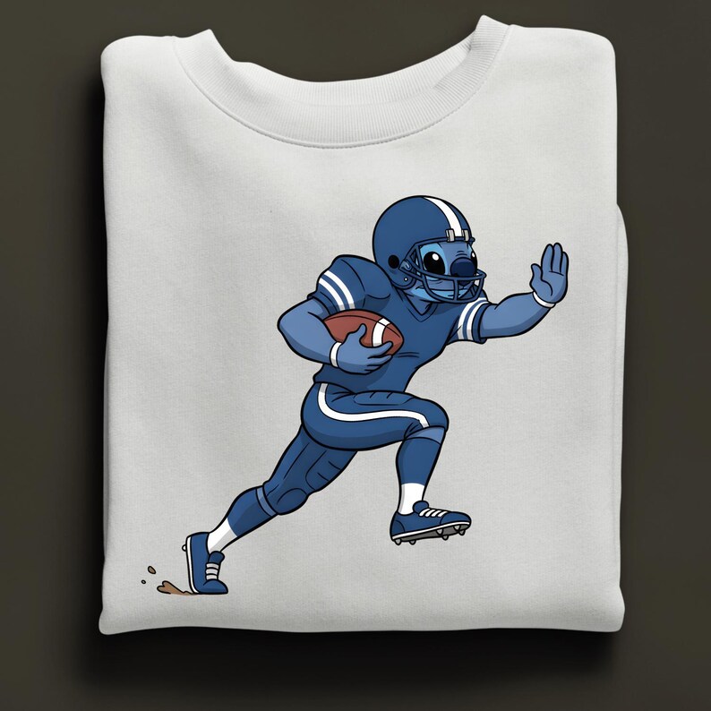 May include: White sweatshirt with a cartoon character in a blue American football uniform, holding a brown ball. The character is running, wearing a blue helmet and shoes. A fun design for sports fans.