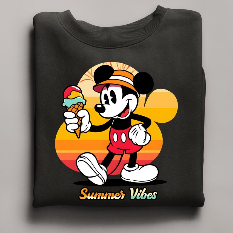 May include: Black sweatshirt featuring a cartoon Mickey Mouse holding an ice cream cone. Mickey is wearing a hat and red shorts. The background has a sunset design with the words "Summer Vibes" in yellow.
