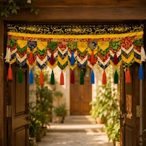 May include: A decorative fabric door valance featuring a black top border with gold patterns, followed by a yellow band and a series of multi-colored, chevron-shaped fabric panels in red, green, blue, and yellow, finished with hanging tassels.