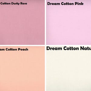 May include: A grid of four fabric swatches labelled Dream Cotton Dusty Rose, Dream Cotton Pink, Dream Cotton Peach, and Dream Cotton Natural. Each square displays a solid, smooth-textured cotton textile in distinct shades of muted rose, light pink, soft peach, and off-white.