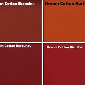 May include: A grid of four fabric swatches labelled Dream Cotton Bronzine, Dream Cotton Rust, Dream Cotton Burgundy, and Dream Cotton Rich Red. Each square displays a solid, flat colour in shades of deep bronze, vibrant rust, dark burgundy, and rich red.