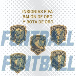 May include: Five embroidered patches featuring the FIFA World Cup logo in gold and blue. The patches display the years 2014, 2018, and 2022. The text INSIGNIAS FIFA BALÓN DE ORO Y BOTA DE ORO is printed in gold above the patches on a white background.