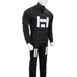 May include: A black long-sleeved shirt and matching pants set featuring white geometric block accents on the chest and thighs. The garment includes a high mock neck collar and prominent white contrast stitching throughout the fabric design.