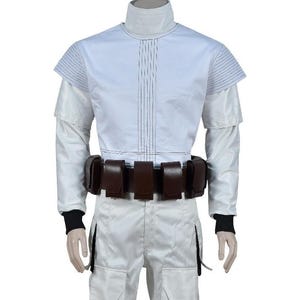 May include: A white costume with a high collar, long sleeves, and a brown belt with multiple pouches. The outfit has vertical lines down the front and black cuffs. The pants have pockets. The costume is likely for cosplay or a themed event.
