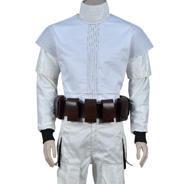May include: A white costume with a high collar, long sleeves, and a brown belt with multiple pouches. The outfit has vertical lines down the front and black cuffs. The pants have pockets. The costume is likely for cosplay or a themed event.