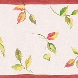 May include: A wallpaper border featuring a repeating pattern of yellow lemons and red cherries on a cream background. The design includes green leaves and thin stems, framed by solid red horizontal stripes along the top and bottom edges.
