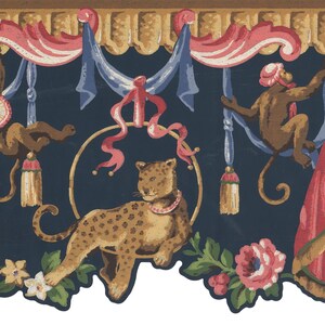 May include: Decorative wallpaper border featuring a leopard with a pink collar, monkeys, and floral accents. The design includes pink and blue ribbons, gold accents, and a dark blue background. The border is approximately 10 inches high.