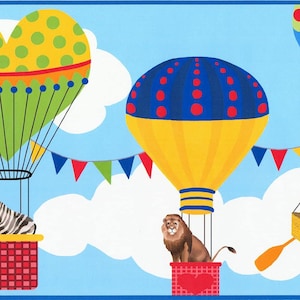 May include: A whimsical illustration of hot air balloons against a blue sky with white clouds. One balloon is yellow and blue with red dots, another is green and yellow with a heart shape. A zebra and a lion are in the baskets.
