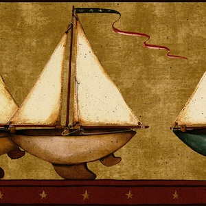 May include: Wallpaper border with three sailboats. The sails are cream-coloured, and the hulls are brown. The background is a textured gold colour, with a red border at the bottom featuring gold stars. A green and red ribbon is attached to the top of the sailboat.