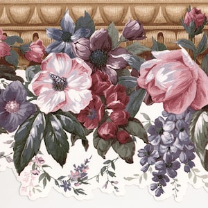 May include: Floral wallpaper border featuring a variety of flowers in shades of pink, purple, and burgundy, with green leaves. The flowers are set against a white background with a scalloped edge and a decorative brown border at the top.