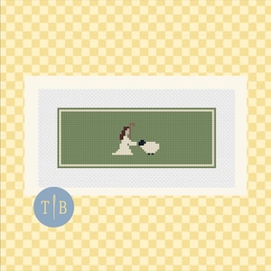 May include: A cross-stitch pattern featuring a figure with brown hair wearing a white garment and holding a staff, standing next to a small white sheep with a black face. The design is centered on a sage green rectangular background with a border.