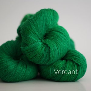 May include: Three balls of bright green yarn, labeled "Verdant".