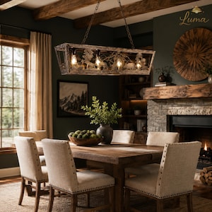 May include: A rustic dining room with a wooden table and chairs. A rectangular chandelier with deer silhouettes hangs above the table. The room has a fireplace, a large window, and a dark green wall.