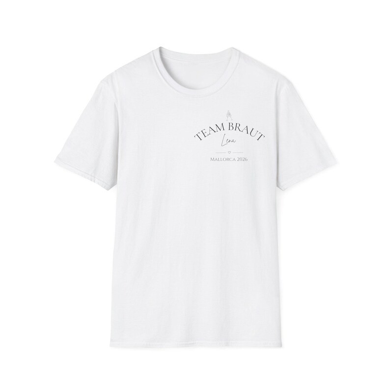 May include: A white short-sleeved t-shirt featuring a small graphic on the upper left chest. The design includes the text "TEAM BRAUT" in an arched font, the name "Lena" in script, a small heart icon, and the text "MALLORCA 2026" below it.