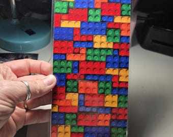 Lego-stenen muur als achtergrond voor een verblijf voor springspinnen / geschikt voor een ruimte van 8x4