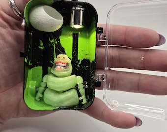 Cápsula de viaje de Slimer, la araña saltarina de los Cazafantasmas