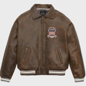 May include: A white ceramic mug with a black handle and the text "But First, Coffee" in a bold, black font. The mug is set against a blurred background, suggesting a cozy setting.