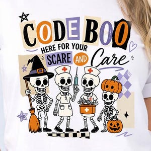 May include: A white short-sleeve t-shirt featuring a graphic of four skeletons dressed for Halloween. The text reads CODE BOO HERE FOR YOUR SCARE AND CARE. One skeleton wears a witch hat, two are dressed as nurses, and one wears a pumpkin hat.