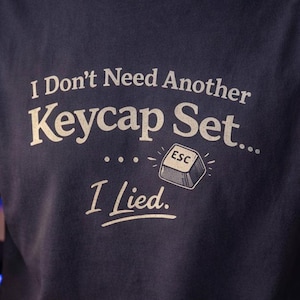 May include: A set of three ceramic mugs with a speckled, matte finish. Each mug features a different color: light blue, cream, and gray. The mugs have a simple, modern design and a comfortable handle. Perfect for coffee or tea.