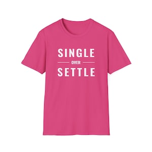 May include: A short-sleeved, fuchsia t-shirt with the white text "SINGLE OVER SETTLE" printed on the front. The text is centered and stacked, with "OVER" in a smaller font size between the other two words.