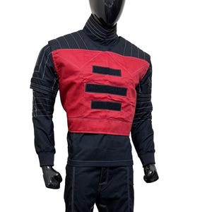 May include: A black and red outfit displayed on a mannequin. The outfit includes a black turtleneck, a red vest with three horizontal black stripes, black pants, and white stitching details. The outfit is designed with a futuristic aesthetic.