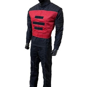 May include: Black and red jumpsuit with white stitching. The outfit includes a high-neck top, a red vest with three black horizontal stripes, and matching pants. The mannequin is standing on a dark gray base.