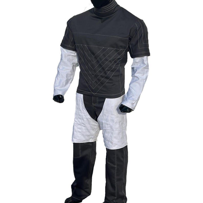 May include: A handmade wooden sign with the text "Welcome" in a playful font. The sign is painted white with a distressed finish, and features a decorative floral design in shades of pink and green. It measures approximately 12 inches wide.