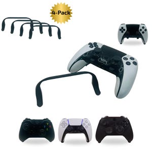 May include: An assortment of black controller grips and game controllers. The image includes a 4-pack of black controller grips, along with several game controllers in black and white colour schemes. The controllers are shown from different angles.