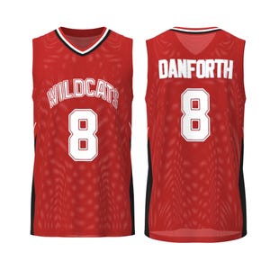 May include: Red basketball jersey with white lettering and the number 8. The front of the jersey reads "WILDCATS" above the number. The back of the jersey reads "DANFORTH" above the number 8.