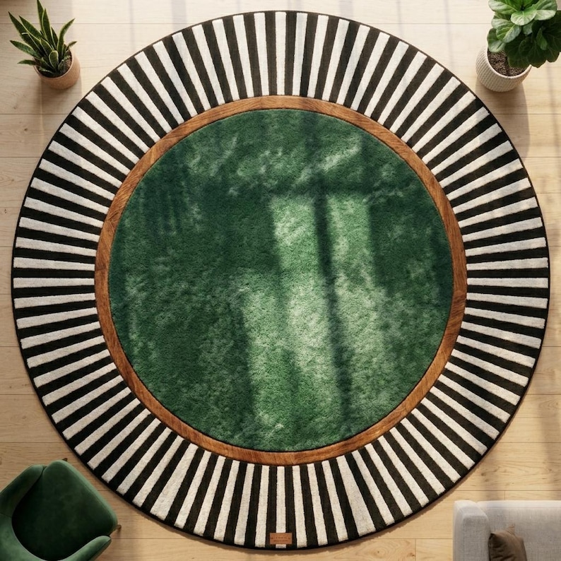 May include: A round rug with a green center, a brown border, and a black and white striped outer edge. The rug is on a wooden floor, and there are plants in pots in the background.