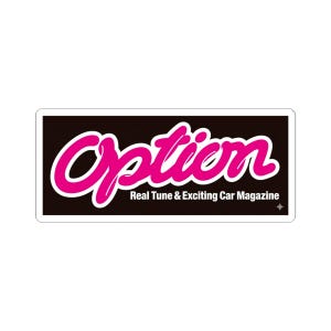 May include: A rectangular sticker with a black background and the word "Option" in pink cursive script. Below, the text "Real Tune & Exciting Car Magazine" is printed in white. A small star is in the lower right corner.
