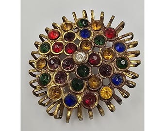 Broche vintage de mediados de siglo con forma de flor de rayos de sol en tono dorado y diamantes de imitación multicolor.