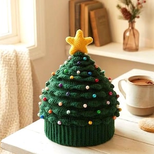 May include: A dark green crocheted hat shaped like a Christmas tree, featuring a ribbed brim and a yellow crocheted star on top. The hat is decorated with small, colorful, round beads scattered across the textured, tiered green surface.