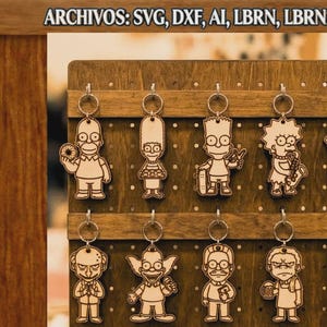 May include: A wooden pegboard display holding ten laser-cut wooden keychains featuring characters from The Simpsons. The text at the top reads ARCHIVOS: SVG, DXF, AI, LBRN, LBRN2, PDF. The characters include Homer, Marge, Bart, Lisa, Maggie, Mr. Burns, Krusty, Ned, Moe, and Smithers.