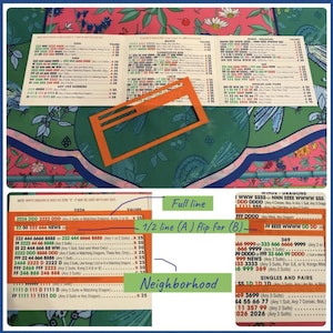 May include: A Mah Jongg score card featuring a tri-fold layout with columns of numbers, letters, and point values. An orange rectangular plastic viewing tool is placed over the card. The card includes sections for 2026, Quints, and Winds.