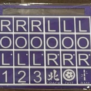 May include: A purple and white word game board with letter tiles. The tiles spell out words and include numbers and symbols. The bottom row has the words CRACK, DOT, and RAM.