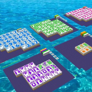 May include: An overhead view of a digital board game set against a blue water background. The game features multiple rectangular platforms with colorful tiles displaying numbers, letters, and symbols. Each platform has a different tile design.