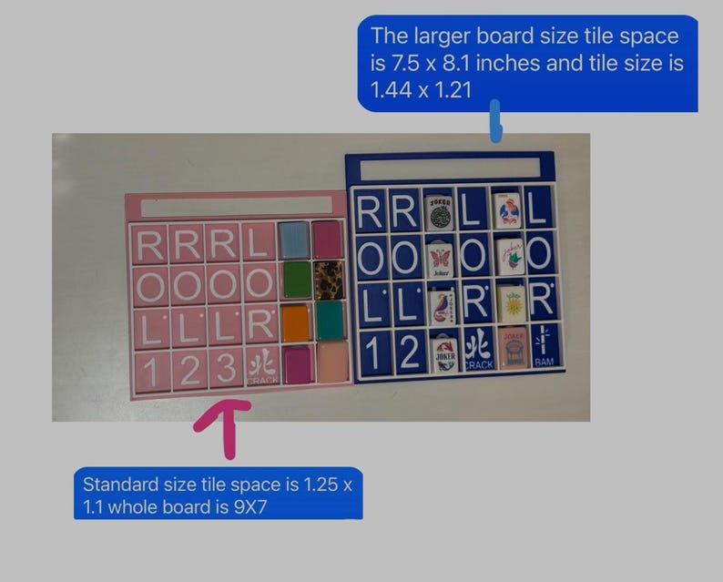 May include: Two tile-based game boards, one pink and one blue, with letter and number tiles. The pink board has a standard tile space of 1.25 x 1.1 inches, and the whole board is 9 x 7 inches. The blue board has a larger tile space of 1.44 x 1.21 inches.