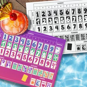 May include: A vibrant image featuring two game boards with numbered tiles and decorative elements. One board is purple and pink, the other is white and black. A cocktail with a pineapple garnish sits nearby, suggesting a leisure theme.