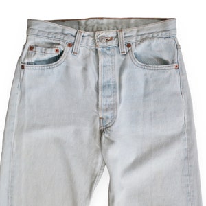 vintage Levis 501 / distressed jeans / 1990s Levis 501 faded light wash denim straight leg high waist jeans 27 image 1
