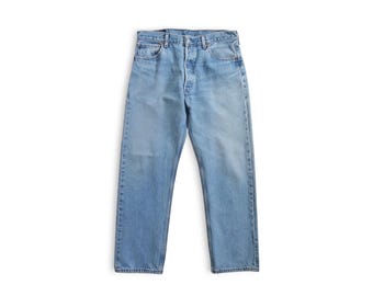 vintage light wash Levis 501s / Y2K Levis 501 stonewash distressed straight leg jeans 32