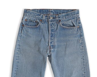vintage Levis 501 / 1980s Levis 501 faded stonewash distressed medium wash jeans 27